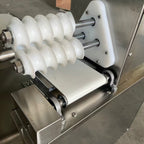 Food grade spiral rounding rollers and discharge conveyor detail